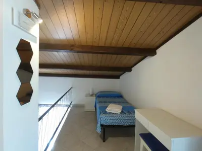 Letto o letti in una camera di Casa Nicea