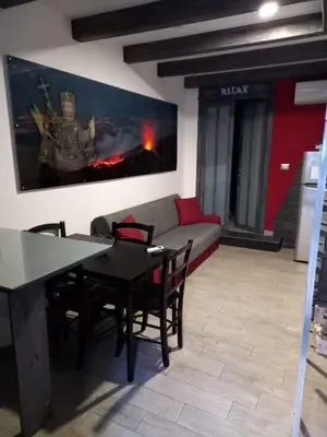 Area soggiorno di suite Holiday House Bonaccorso