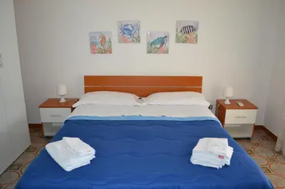 Letto o letti in una camera di Villa Melina