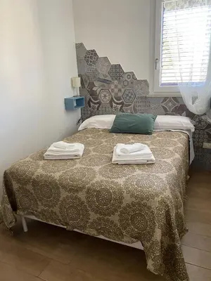 Letto o letti in una camera di Casa vacanze Almàsalo