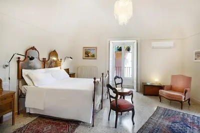 Letto o letti in una camera di Casa Rosa