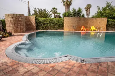 Piscina di VILLA LIBECCIO appartment with shared swimming pool, at 200 meters from the beach, solarium and private parking o nelle vicinanze