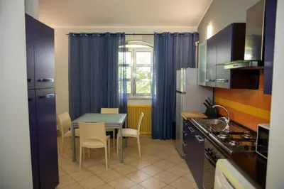 Cucina o angolo cottura di VILLA LIBECCIO appartment with shared swimming pool, at 200 meters from the beach, solarium and private parking