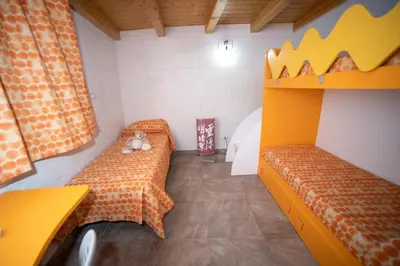 Letto o letti in una camera di la casa di miky