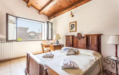 Letto o letti in una camera di Casa Olivella