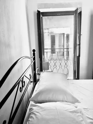 Letto o letti in una camera di La casa con il terrazzo,via arizzi Ortigia