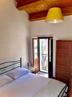 Letto o letti in una camera di La casa con il terrazzo,via arizzi Ortigia