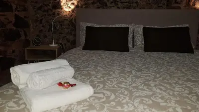 Letto o letti in una camera di La Piccola Grotta Ursino