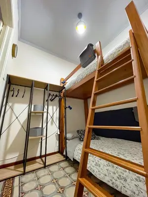 Letto o letti a castello in una camera di Wunderkammer Art Gallery Home Catania
