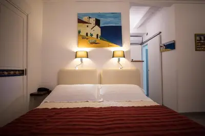 Letto o letti in una camera di Aretusa Vacanze B&B