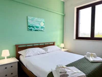 Letto o letti in una camera di Calauriia Apartments Marzamemi