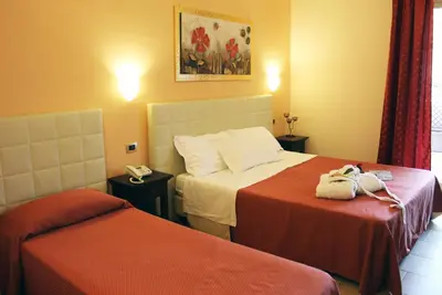 Letto o letti in una camera di Hotel Vittorio Emanuele