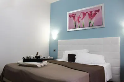 Letto o letti in una camera di Hotel Vittorio Emanuele