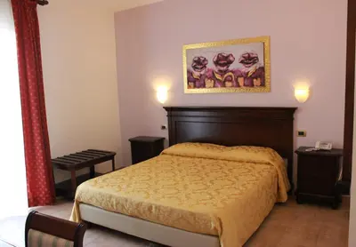 Letto o letti in una camera di Hotel Vittorio Emanuele