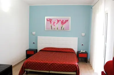 Letto o letti in una camera di Hotel Vittorio Emanuele