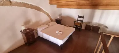 Letto o letti in una camera di Il Casale Apartament&Rooms