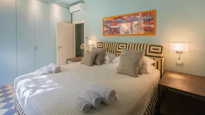 Letto o letti in una camera di VILLA PASSO DEGLI AIRONI 12, Emma Villas