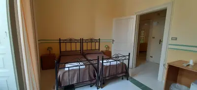 Letto o letti in una camera di Hotel Casa Mia