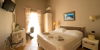 Letto o letti in una camera di Charme Hotel Villa Principe Fitalia