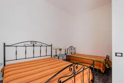 Letto o letti in una camera di Terre di mare near the sandy beach with pool, parking & wifi