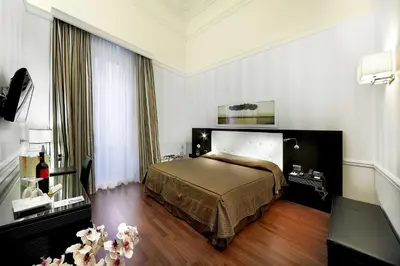 Letto o letti in una camera di Il Principe Hotel Catania