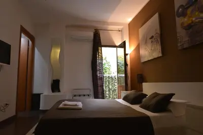 Letto o letti in una camera di Globetrotter Catania Palace