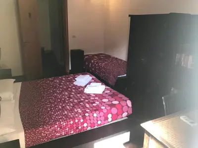 Letto o letti in una camera di Globetrotter Catania Palace