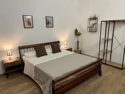 Letto o letti in una camera di B&B Melissa