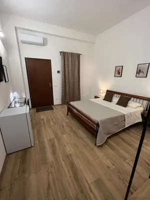 Letto o letti in una camera di B&B Melissa