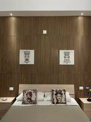 Letto o letti in una camera di B&B Melissa