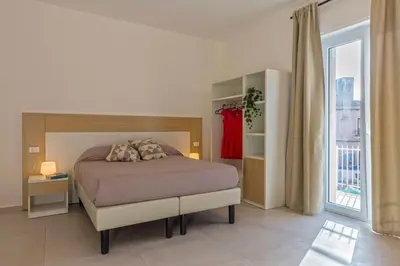 Letto o letti in una camera di Syraka Camere