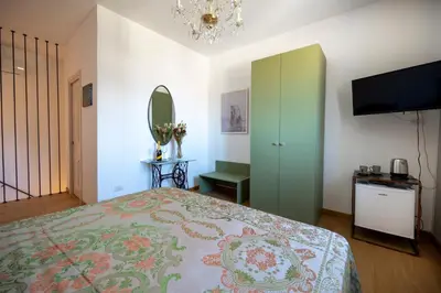 Letto o letti in una camera di SUITE VITTORIO VENETO