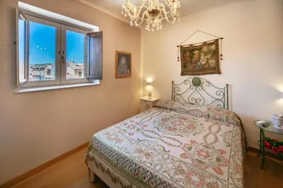 Letto o letti in una camera di SUITE VITTORIO VENETO