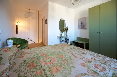 Letto o letti in una camera di SUITE VITTORIO VENETO