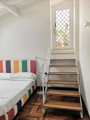 Letto o letti in una camera di L'Approdo delle Sirene