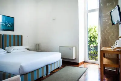 Letto o letti in una camera di L'Approdo delle Sirene