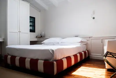 Letto o letti in una camera di L'Approdo delle Sirene