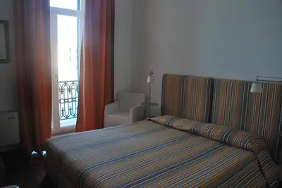 Letto o letti in una camera di L'Approdo delle Sirene