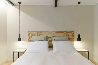 Letto o letti in una camera di Crociferi Luxury Apartment