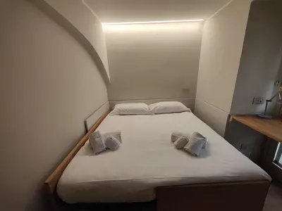 Letto o letti in una camera di Crociferi Luxury Apartment