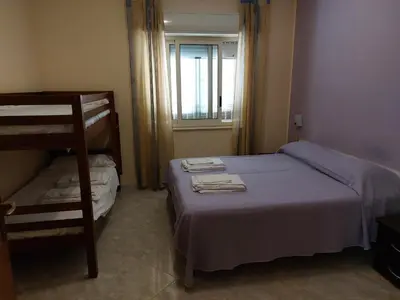Letto o letti in una camera di Residence Cuba alloggi per turismo