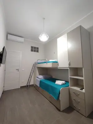 Letto o letti in una camera di Casa Violetta