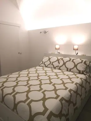 Letto o letti in una camera di Casetta Verga Loft