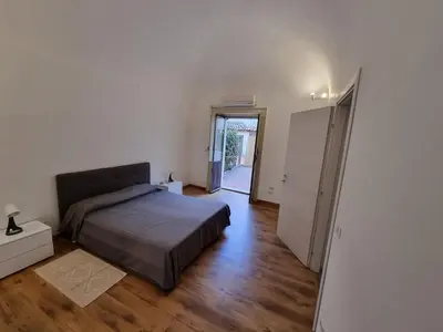 Letto o letti in una camera di Palazzo Mannino Apartments