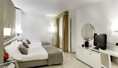 Letto o letti in una camera di Mediterraneo Palace Hotel
