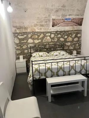 Letto o letti in una camera di Casa Vittoria