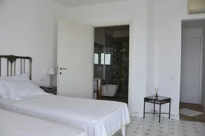 Letto o letti in una camera di Giuggiulena