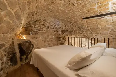 Letto o letti in una camera di Case degli Avi 2, antico abitare in grotta