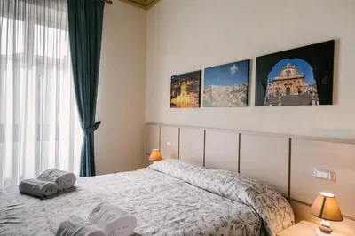 Letto o letti in una camera di Le Camere dei Conti
