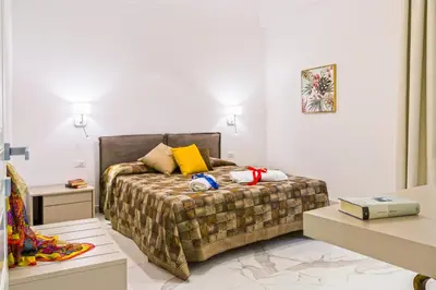 Letto o letti in una camera di Corinzia Casa Vacanze